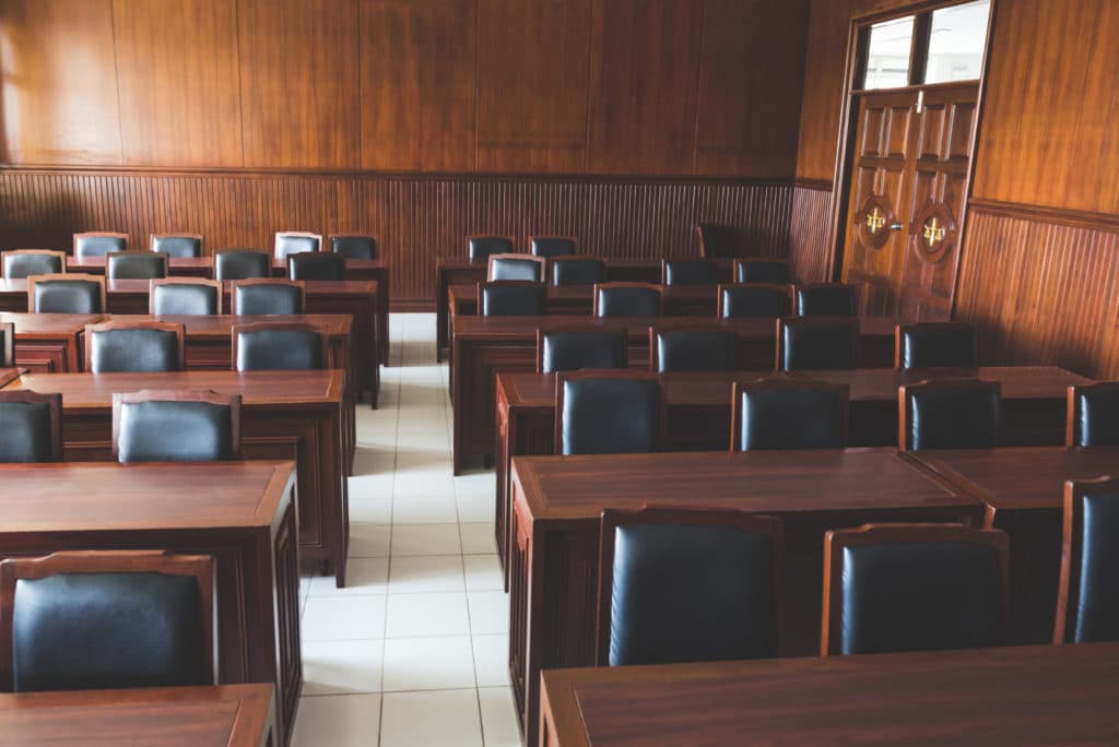 an empty courtroom where the shadow jury will sit during the court proceeding