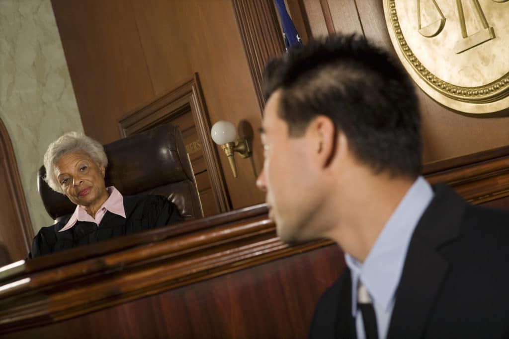 Witness in front of judge in court