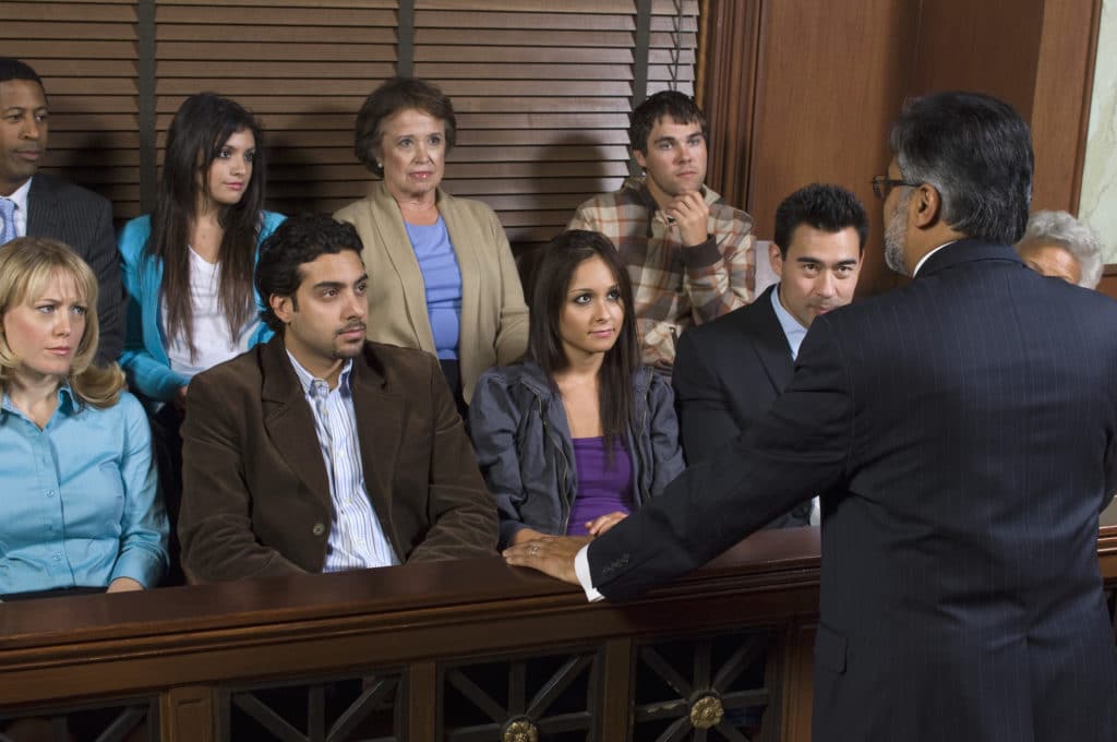 an attorney speaking to a jury of men and women