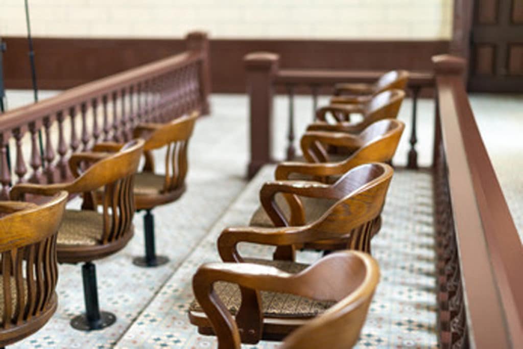 Empty juror chairs in an El Paso courtroom.